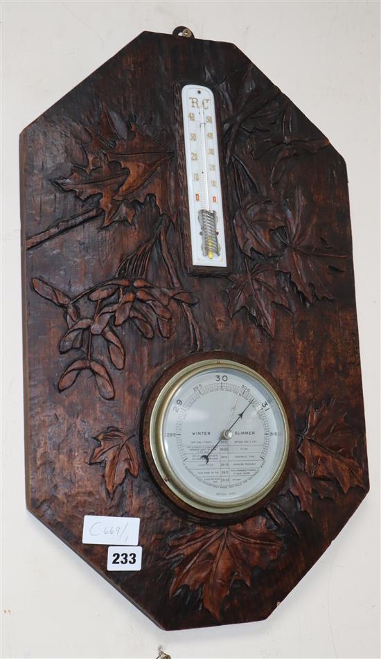 A carved Black Forest barometer / thermometer